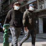 two men with face masks against coronavirus