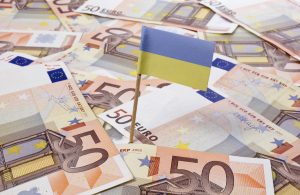 Flag of Ukraine sticking in 50 Euro banknotes