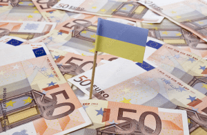 Flag of Ukraine sticking in 50 Euro banknotes