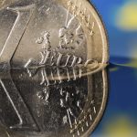euro coin under water