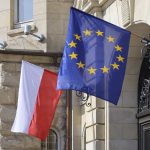 Polish and European Union flags waving together