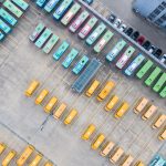 Top-down aerial view into a bus depot